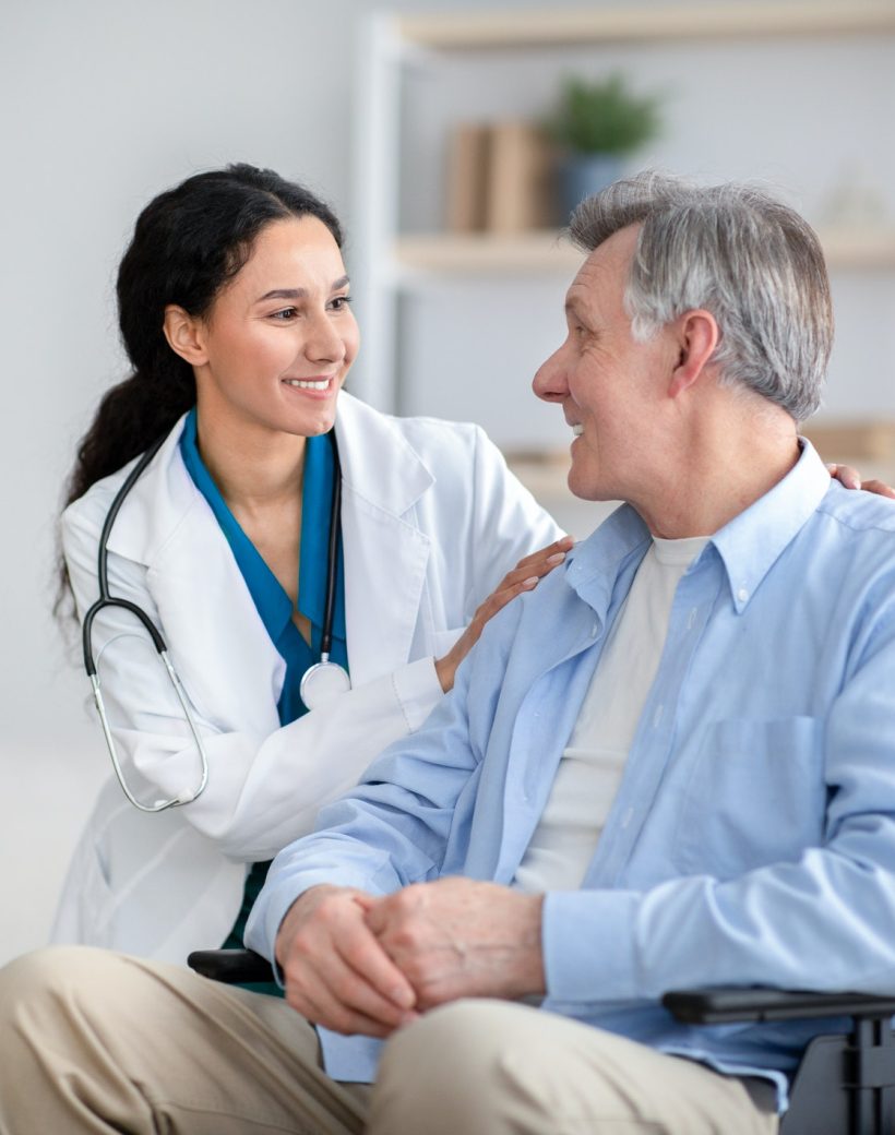 impaired-senior-man-in-wheelchair-and-young-nurse-taking-care-of-him-at-home.jpg